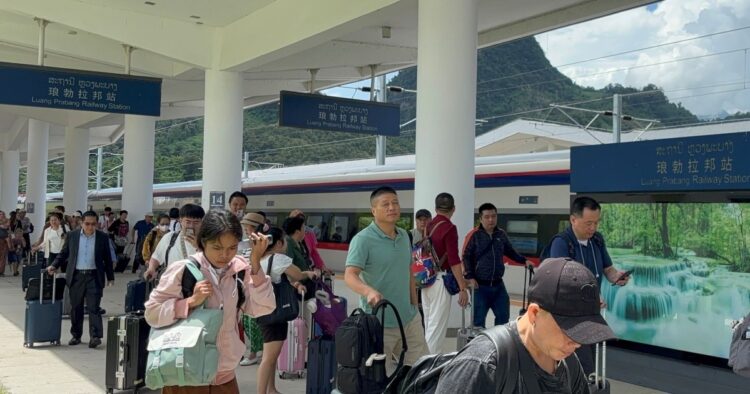 Chinese trains, tourists and money are flooding Laos. Laotians wonder if it makes sense