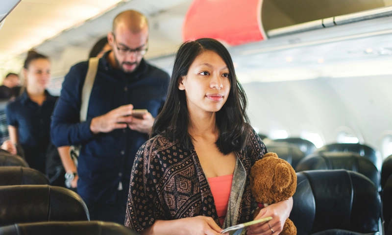 A group of people exiting an airplane