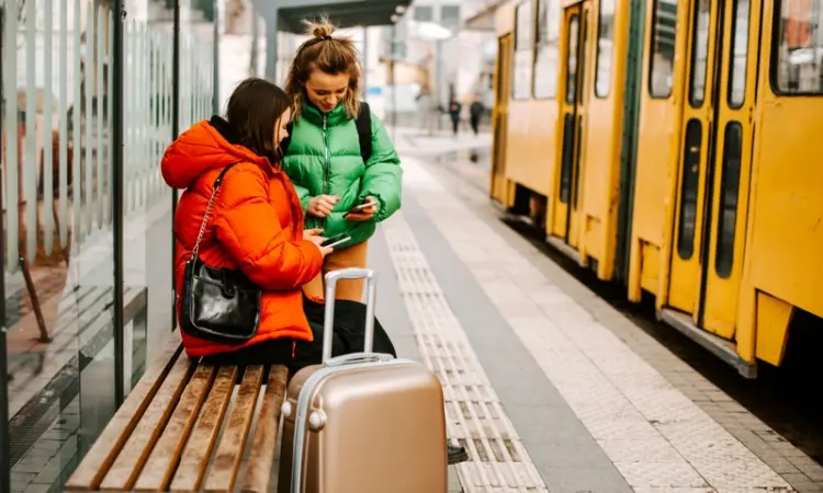 Two women at a railway station