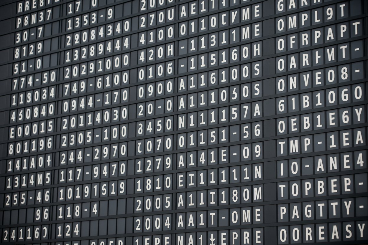 A busy airport terminal showing passengers waiting for timely boarding.