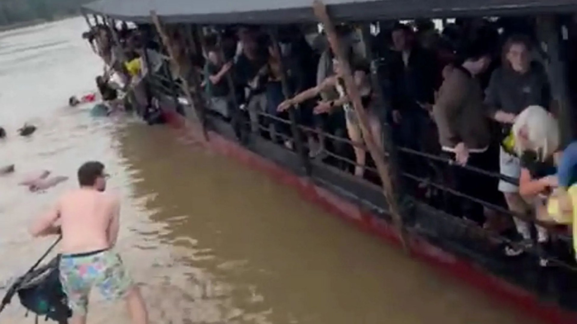Terrifying moment Brit tourists scramble to safety as water fills sinking ferry after hitting rock &...
