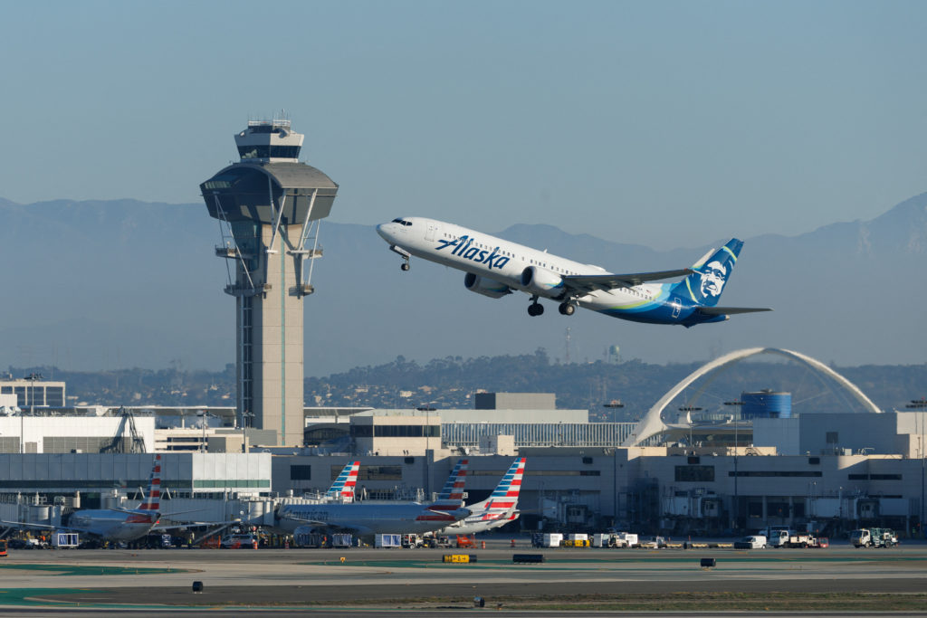 Commercial airliners take-off from Los Angeles International Airport