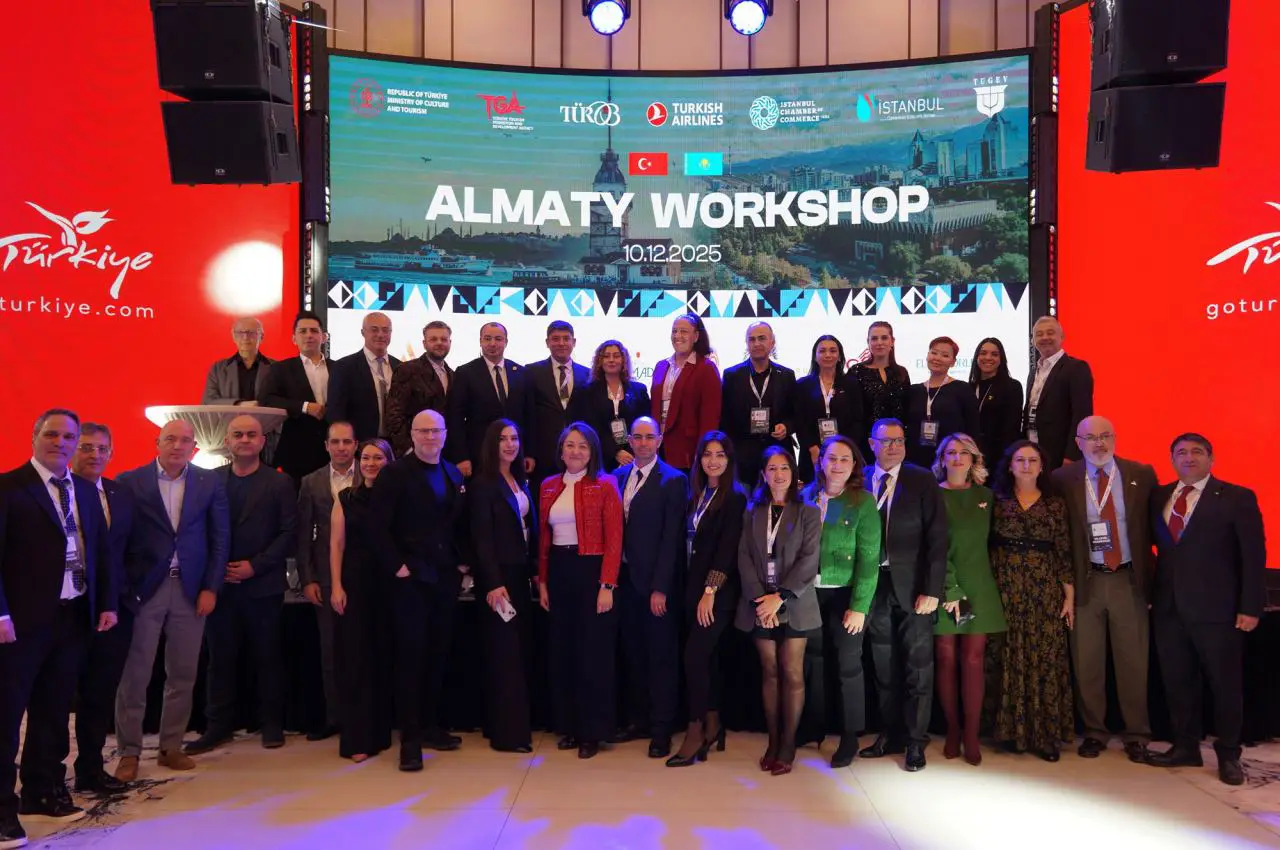 Group photo of tourism officials and industry representatives at the Almaty Workshop event