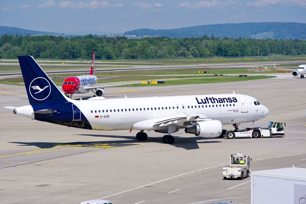 a large Lufthansa plane on the runway in Germany