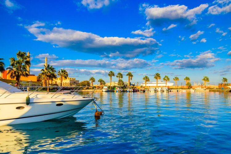 White yachts moored in Hurghada’s marina as tourist boats line the Red Sea coast, Hurghada, Egypt, December 12, 2025. (Adobe Stock Photo)