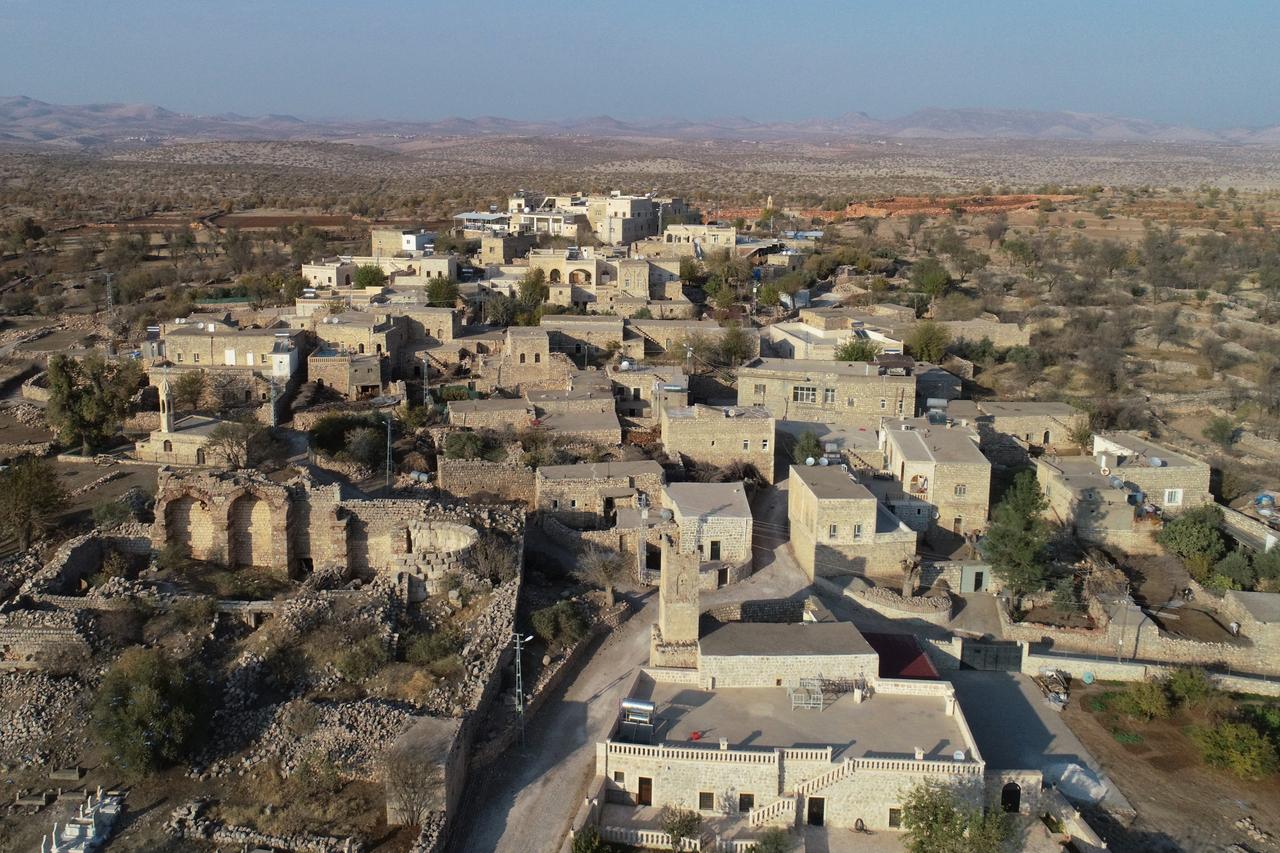 An aerial view shows the historic stone houses, the remains of the Mor Sobo Cathedral that served as a metropolitan center for nine centuries, and the Meryem Ana Church built atop a 2,000-year-old monument in Midyat’s Anitli neighborhood, which was included in the UN World Tourism Organization’s “Best Tourism Villages 2025” list, in Mardin, Türkiye, Dec. 3, 2025. (AA Photo)