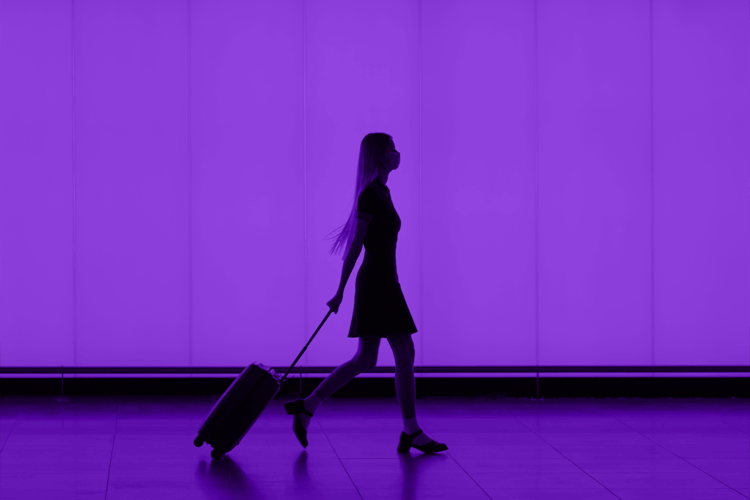 person in front of purple screen