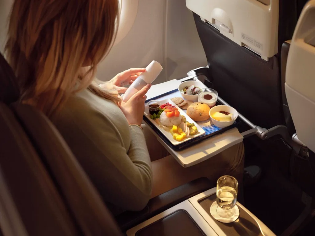 A British Airways Club Europe passenger with a meal.