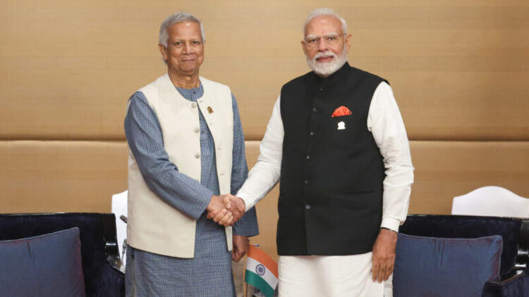 PM Modi meeting with the Chief Adviser of the People’s Republic of Bangladesh, Mr. Muhammad Yunus at Bangkok, in Thailand on April 04, 2025. Image via Wikipedia by Press Information Bureau of India. Public Domain.