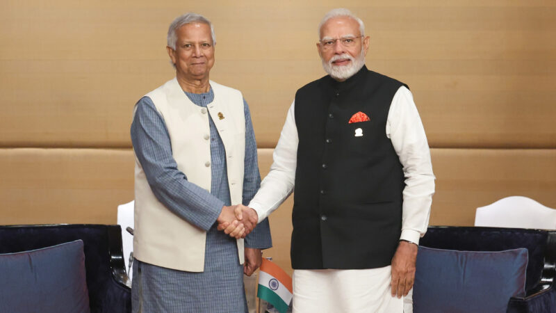 PM Modi meeting with the Chief Adviser of the People’s Republic of Bangladesh, Mr. Muhammad Yunus at Bangkok, in Thailand on April 04, 2025. Image via Wikipedia by Press Information Bureau of India. Public Domain.