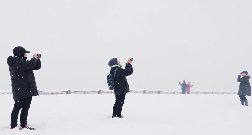 Tourists Capture Moments in Snow at Gochang Eupseong, South Korea as Snowfall Enhancing Winter Touri...