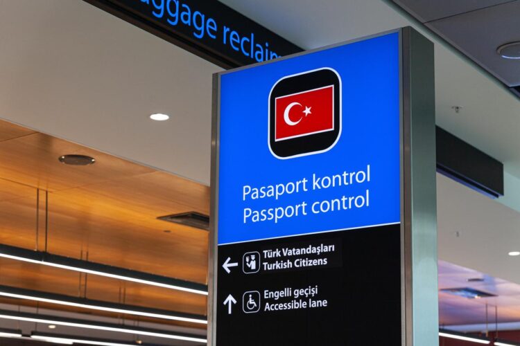 Photo shows Turkish passport control, information board with national flag in Sabiha Gokcen Airport, Istanbul, Türkiye, accessed on Dec. 31, 2025. (Adobe Stock Photo)