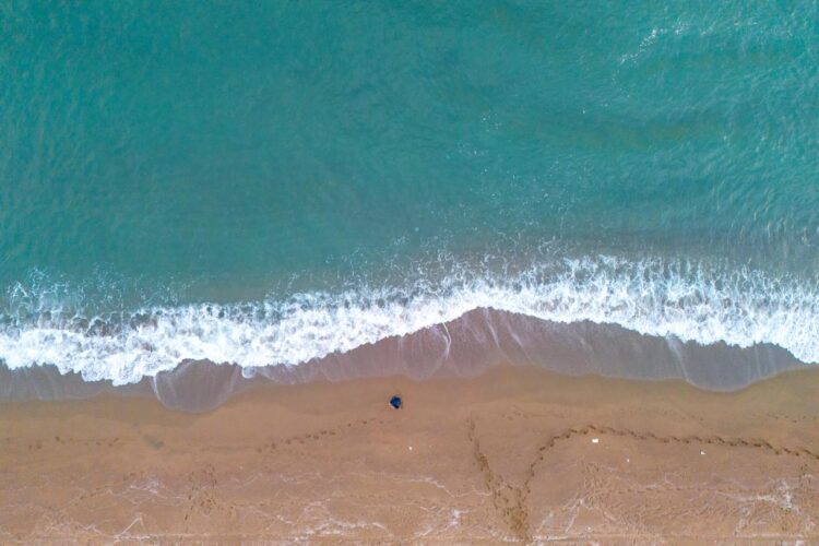 Aerial view shows the sandy shoreline of Karasu in Sakarya province meeting turquoise waves along the Black Sea coast near Adapazari, Türkiye, accessed on January 8, 2025. (Adobe Stock Photo)