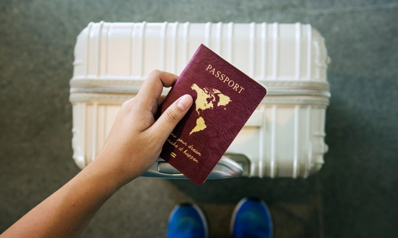 A woman holding a passport