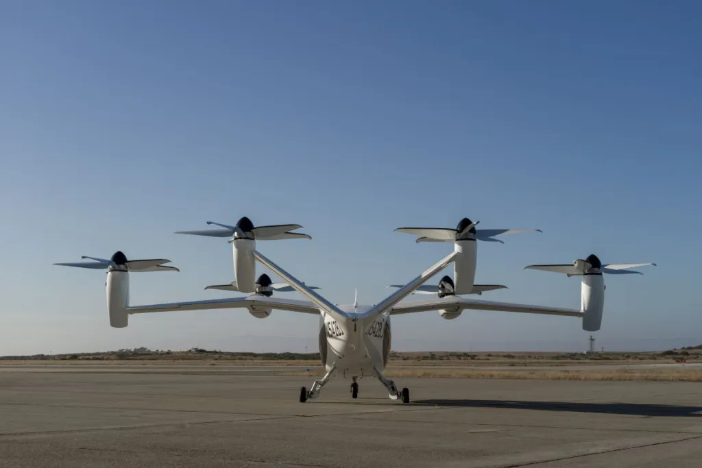 A prototype Joby aircraft at an airfield.