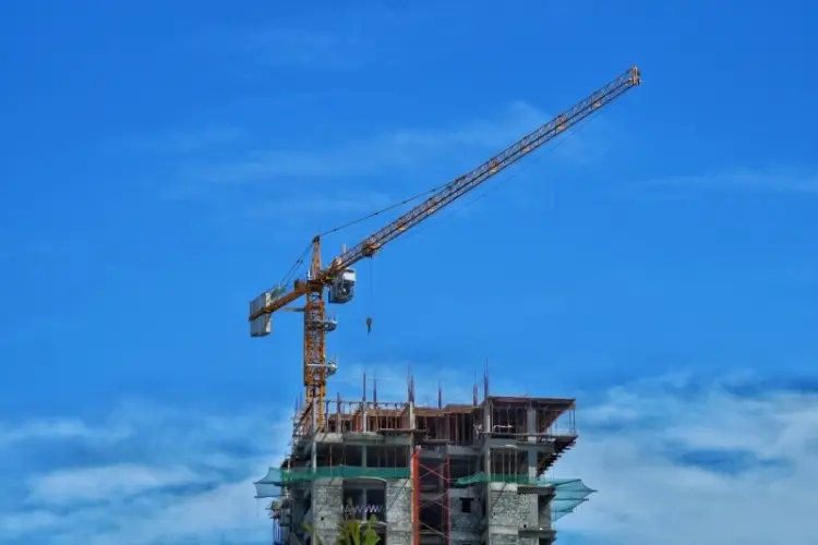 A crane at the top of a building