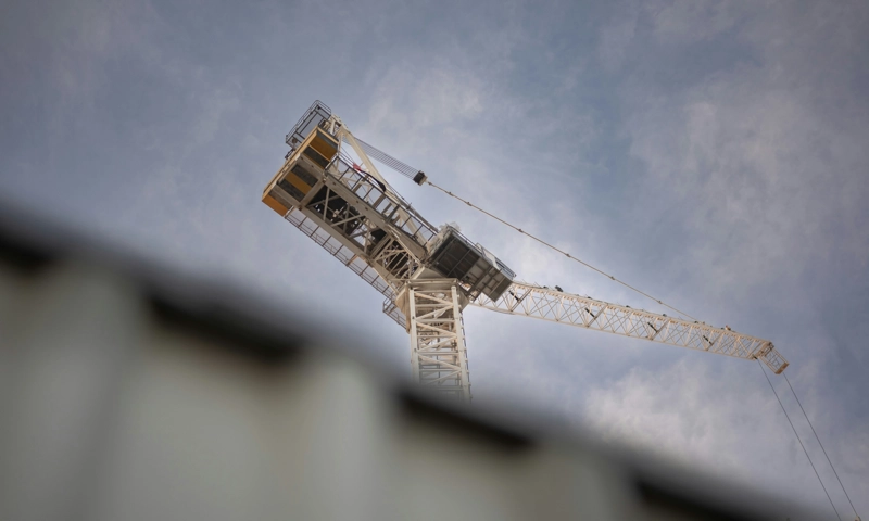 A construction crane over new high-rise construction.