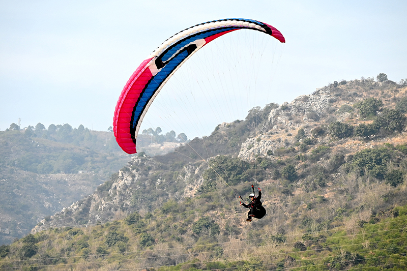 A view of paragliding during the two-day Pakistan Tourism, Sports and Family Festival at Shalimar Cr...
