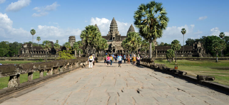 People at the main entrance of Angkor Wat in Siem Reap Cambodia. The temple has become a symbol of Cambodia