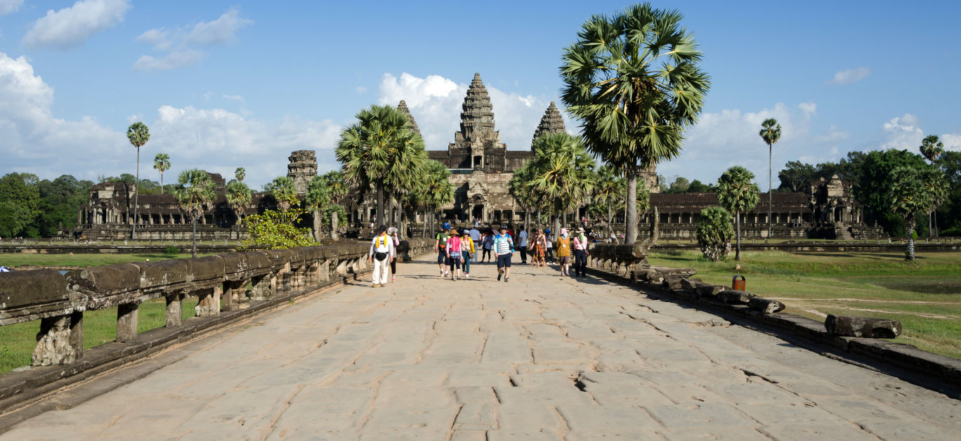 People at the main entrance of Angkor Wat in Siem Reap Cambodia. The temple has become a symbol of Cambodia