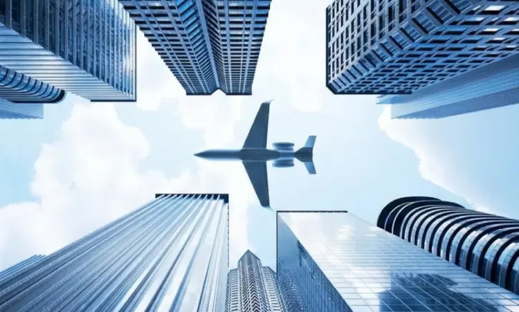 A plane flying over skyscrapers