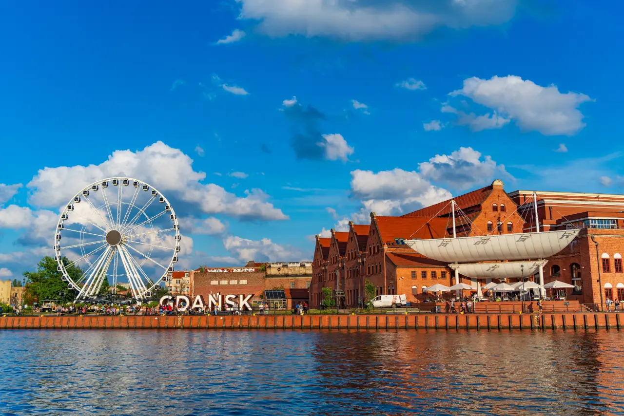Amber Sky Ferris wheel and Baltic Philharmonic on Motlawa River in Gdansk