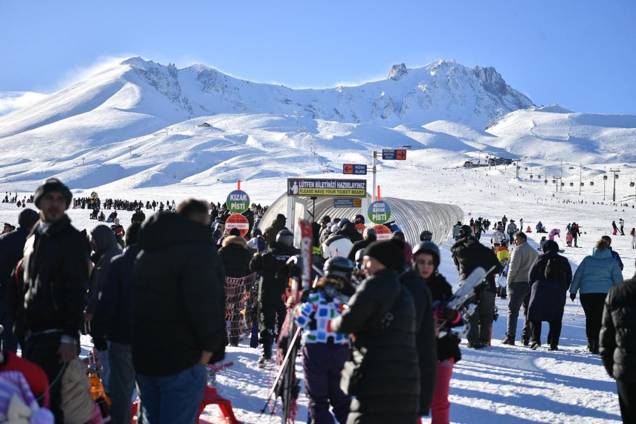 Visitors enjoy skiing at Erciyes Ski Center on the first day of 2025, Kayseri, Türkiye, Jan.-uary 2, 2024. (AA Photo)