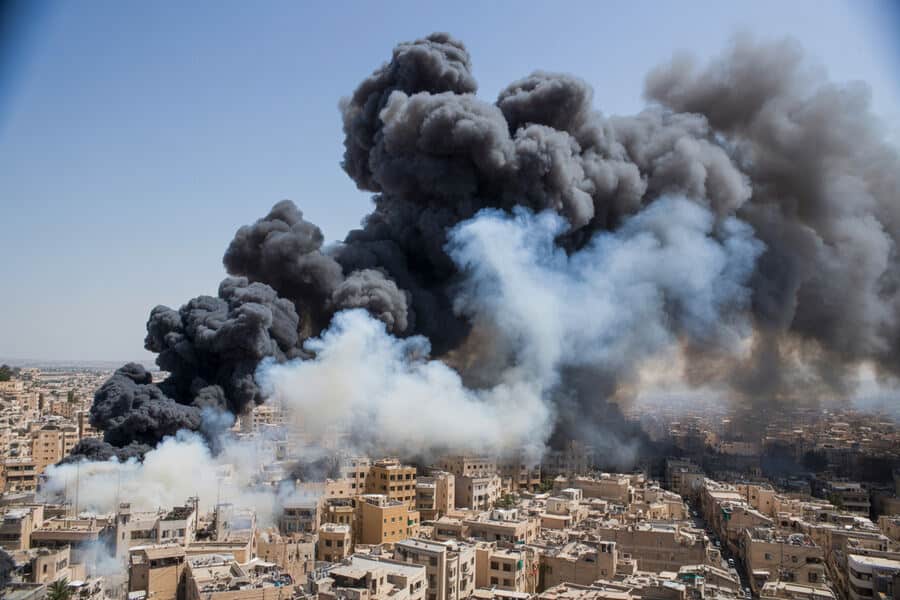 Smoke and fire over a city due to a large explosion or fire incident.