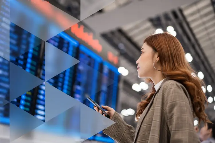 Woman sitting on armchair looking at her mobile
