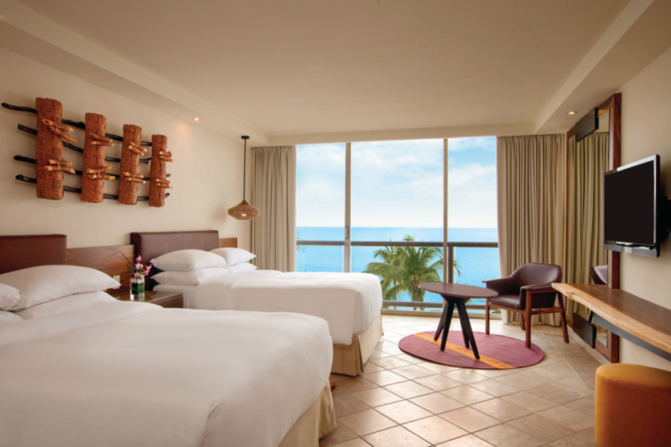 a guest room with a view of the ocean at a Hyatt hotel in Puerto Vallarta