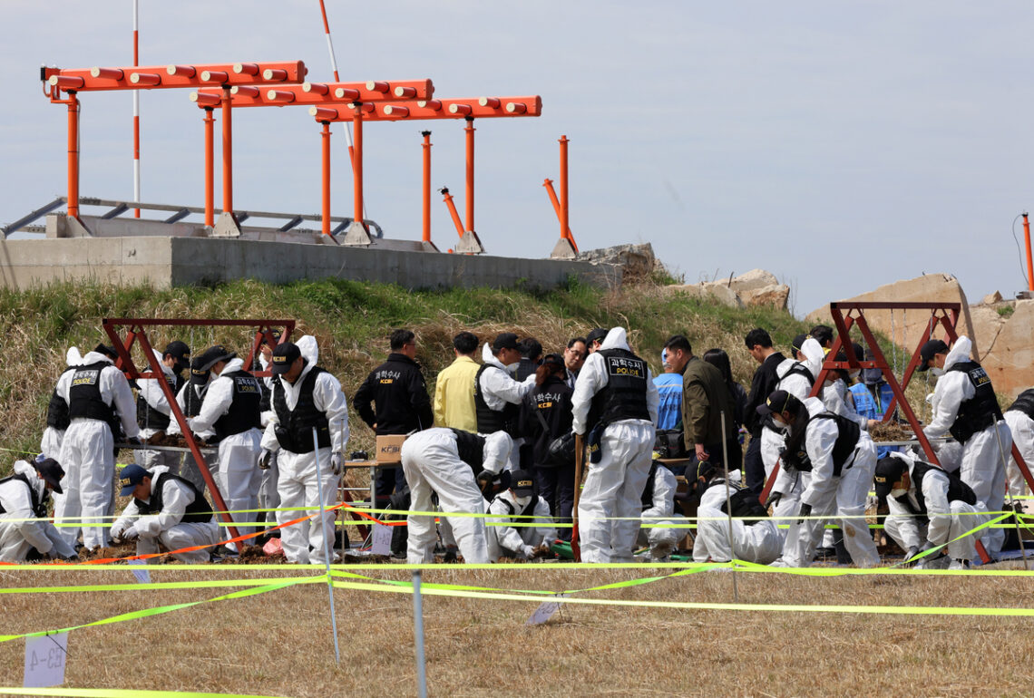 Police forensic investigators conduct a second search at Muan International Airport in South Jeolla Province on the 13th to recover unidentified remains from the Jeju Air passenger jet disaster. Yonhap News - Seoul Economic Daily Society News from South Korea
