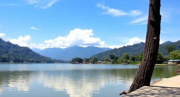 Beautiful view of phewa lake with mountains in the background, showcasing nepal’.