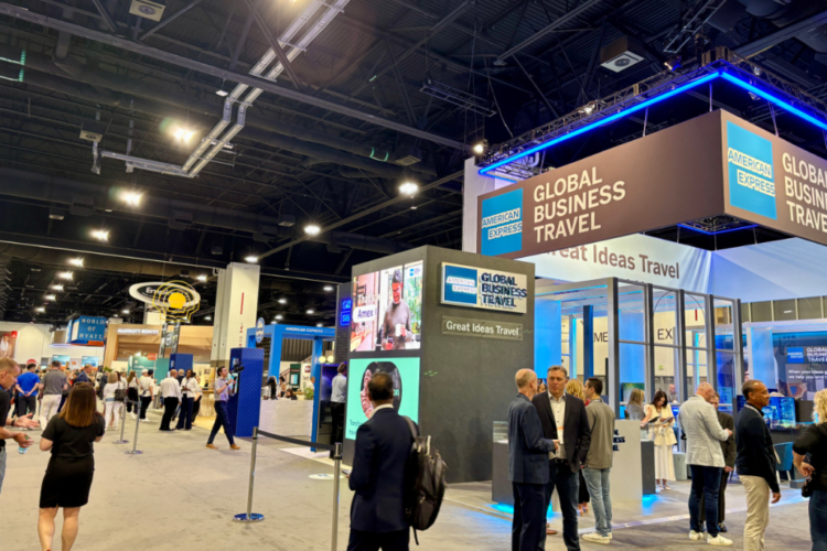 people in the corporate travel industry walking around a trade room show floor
