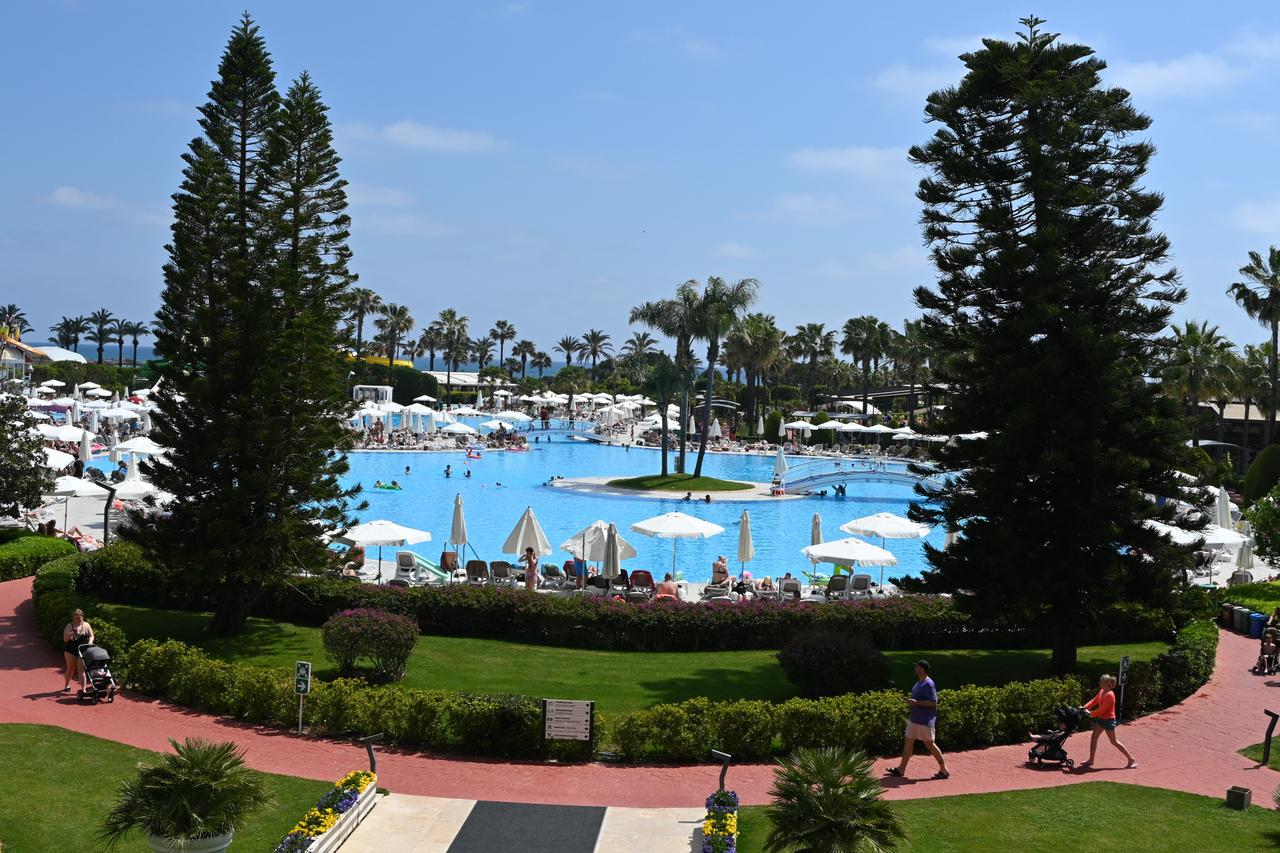 Tourists relax by a large resort pool in Antalya, April 30, 2026. (AA Photo)
