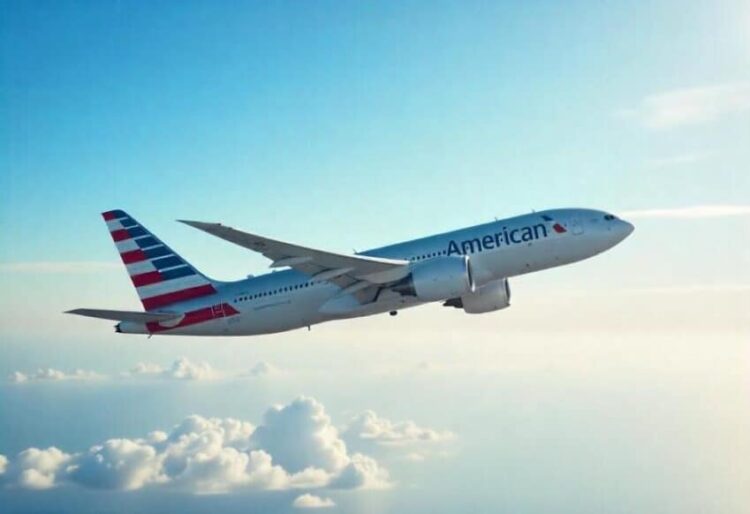 American airlines jet flying at high altitude.
