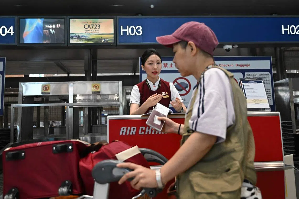 A passenger at Beijing International Airport. Foreign visitors are advised to stick closely to their declare travel purposes.