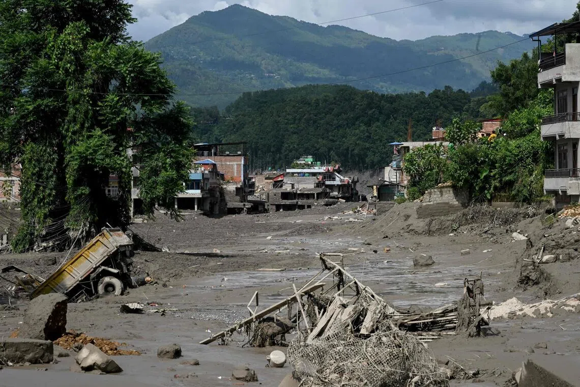 Houses lie deluged in sludge after flash floods at Trishuli Bazar in Nepal’s Nuwakot district on Aug 26.